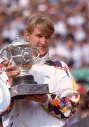 Steffi Graf of Germany poses with the trophy after defeating Mary - Old Photo 1