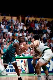 Larry Johnson Charlotte Hornets handles the ball v Kevin McHale Bo- Old Photo