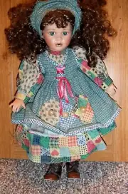AN 18 INCH DOLL COLLECTIBLE, PATCHWORK CLOTHING, CURLY HAIR, LAYERED DRESS, NEW,