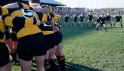 The Newport team in a "huddle" whilst the New Zealand All Blacks - Old Photo