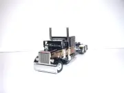 DCP FIRST GEAR 1/64 BLACK AND GOLD PETERBILT 379 WITH 63" SLEEPER