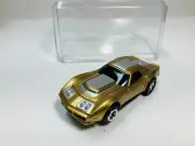 AFX tras CANDY GOLD CORVETTE AW Chassis & Display case Aurora NEW!