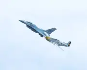 8x10 photo of a modern US Jet and a WWII fighter plane at an airshow.