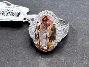 Bella Luce champagne diamond simulated 13.00ct oval & white diamond Rhodium