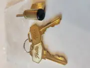 PELLA KEY CYLINDER BRONZE FACE WITH TWO KEYS, NEW IN PACKAGE