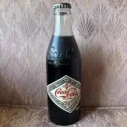 Coca-cola 75th Anniversary bottle of coke full unopened 1902-1975