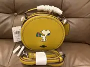 NWT Coach CF290 X Peanuts Canteen Crossbody w/Snoopy Present Motif FLAX Leather