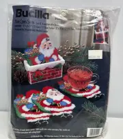 BUCILLA Plastic Canvas Kit - Here Comes Santa Coaster Set - 4 Coasters + Holder