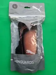 Puma soccer shinguards. Size LARGE Brand new sealed