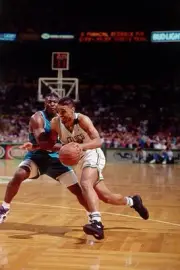 Rick Fox Boston Celtics drives past Larry Johnson Charlotte Hornet- Old Photo