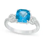 8.0mm Cushion-Cut Blue Topaz and 0.10 CT. T.W. Natural Diamond Ribbons Ring in Sterling Silver