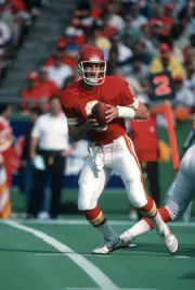 Bill Kenney Kansas City Chiefs drops back to pass in an - Football 1988 Photo
