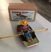 Vintage Rowing Boat Wind Up Tin Toy NOS Japan 8”x 3 3/4” Paddles Tip to Tip 14”