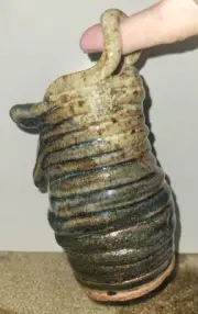 ~6" CERAMIC COIL JAR W/ HANDLE. PLUS A MYSTERY GIFT CERAMIC VALUED ~ $10.