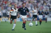 Scottish footballer Maurice Malpas makes a run with the ball as Ge- Old Photo