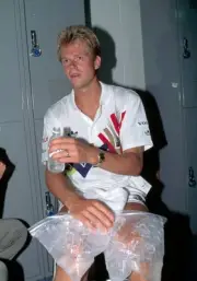 Stefan Edberg of Sweden nurses his knees with ice packs after defe- Old Photo 1