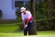 Golfer Juan Chi Chi Rodriguez swings and watches the flight of Golf 1988 Photo 6