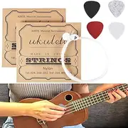 2 Sets of Nylon Ukulele Strings with 4 Felt Picks, Strings are White, Picks are Red, Gray, White, and Black.