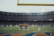 Quarterback John Elway Denver Broncos huddles with the offense dur- Old Photo