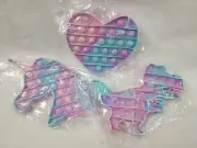 3 Piece Pop It Dino Unicorn Heart fidget set.