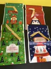 9 x 6 drawstring gold ribbon thick plastic printed Christmas bags lot of 40
