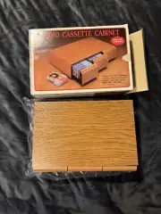 NEW AUDIO CASSETTE CABINET DELUXE OAK VINYL FINISH HOLDS 36 TAPES K-MART