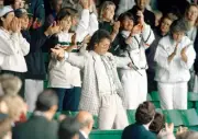 Cliff Richard performs on Centre Court during a rain delay at the - Old Photo