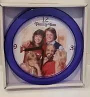 Family Ties Purple 7" Novelty Wall/Desk Clock. Brand New. Michael J Fox