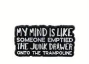My mind is like someone emptied the junk drawer onto the trampoline enamel pin