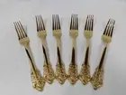 Baroque style. Stainless steel, gold plated set of six dinner forks.