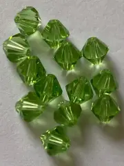 10 Genuine Swarovski Crystal Peridots 6mm Bicone. Free postage no tracking