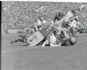 Louis Baldacci Plowing Through Player Pileup 1955 Photo - Caught in the middle..