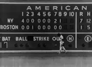 Jim Rice Boston Red Sox is framed against the scoreboard as time i- Old Photo