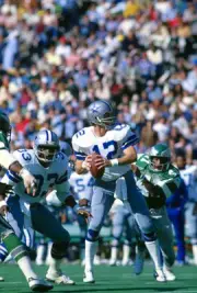 Quarterback Roger Staubach of Dallas Cowboys drops back to pass v - Old Photo 10