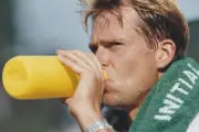 Swedish tennis player Stefan Edberg drinking from a water bottle d- Old Photo