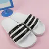 【iSport愛運動】adidas ADILETTE SHOWER 運動拖鞋 正品 AQ1702 男女款 白底黑線