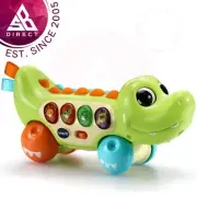 VTech Squishy Spikes Alligator Push Along Baby Toy with 4 Buttons Lights, Sounds