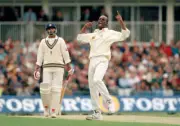 England bowler Chris Lewis celebrates after dismissing Vinod - Old Cricket Photo