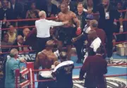 Referee Mills Lane pushes Mike Tyson back and away from the corner- Old Photo