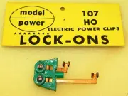 1 OF TRACK LOCK-ONS ELECTRIC POWER CLIPS HO SCALE MODEL POWER #107 NEW OLD STOCK