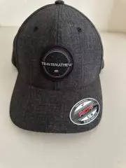 Travis Mathew New Flexfit Heather Black Baseball Cap with Emblem Size S/M w tags