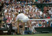 Boris Becker of Germany speaks to the net judge during Wimbledon J- Old Photo