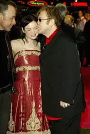 Renee Zellweger and musician Elton John arrive at the UK Gala Pre- 2004 Photo 7