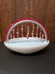 Sparkling Fountain, water flows down the beads.