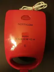 Nostalgia My mini Sandwich Maker, Red model # MSNDW5RD 120V AC/60HZ never used.