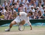 Jeremy Bates of Great Britain falls after slipping on the grass du- Old Photo