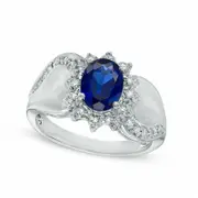 Oval Lab-Created Blue Sapphire and 0.10 CT. T.W. Diamond Sunburst Frame Swirl Ring in Solid 10K White Gold