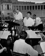 Singer Frank Sinatra rendering a song as conductor Max Steiner- 1940s Photo 5