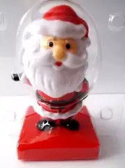 Solar Powered Santa Bobble Head / Holding A Present Bag