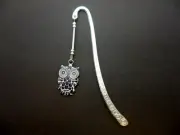 A TIBETAN SILVER BOOKMARK WITH A BLACK ENAMEL OWL CHARM. NEW.